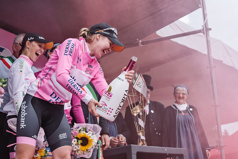 Anna van der Breggen celebrates her overall win with a bottle of champagne