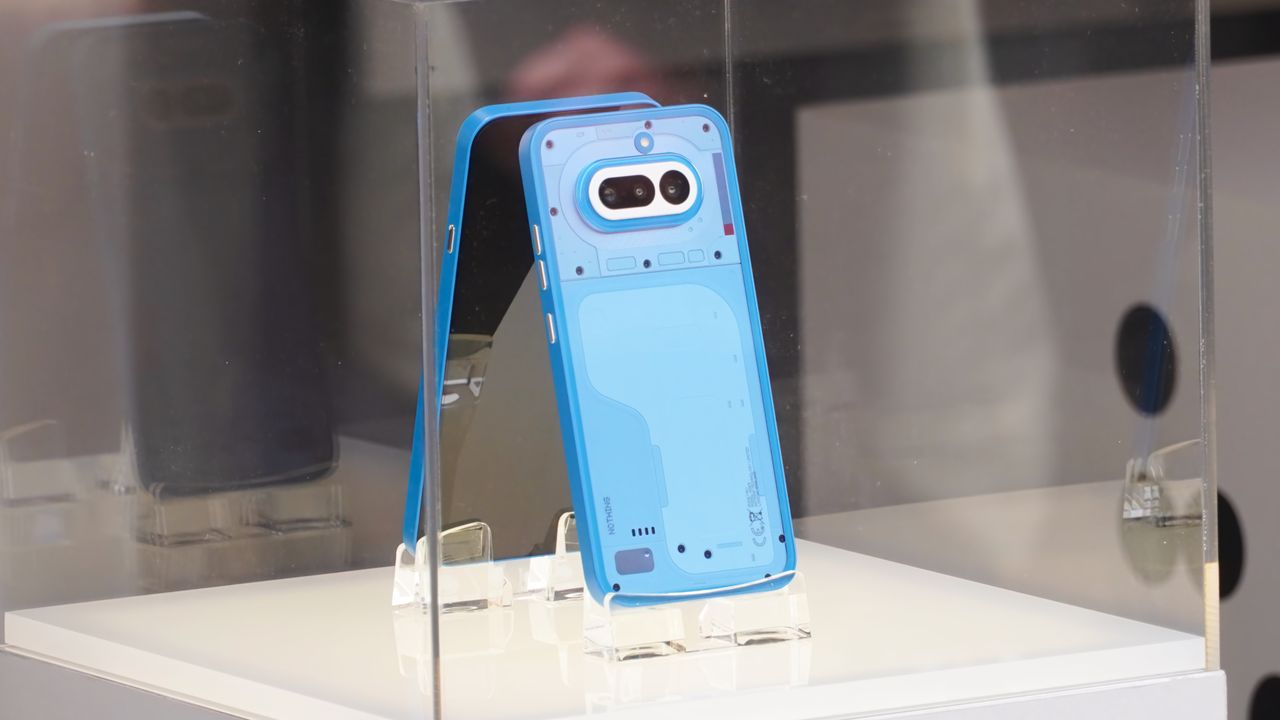 The Nothing Phone 4a on display at MWC 2026 in Black, White, Blue, and Pink colorways.