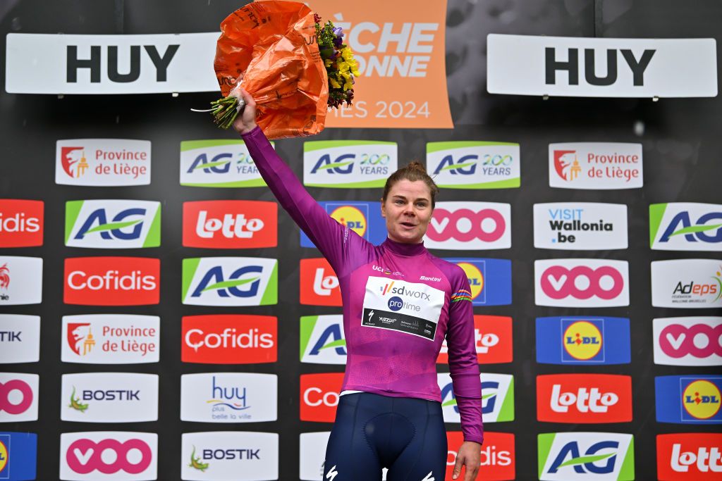 HUY BELGIUM APRIL 17 Lotte Kopecky of Belgium and Team SD Worx Protime celebrates at podium as Pink UCI Womens WorldTour Leader Jersey winner during the 27th La Fleche Wallonne Feminine 2024 a 146km one day race from Huy to Huy UCIWWT on April 17 2024 in Huy Belgium Photo by Luc ClaessenGetty Images