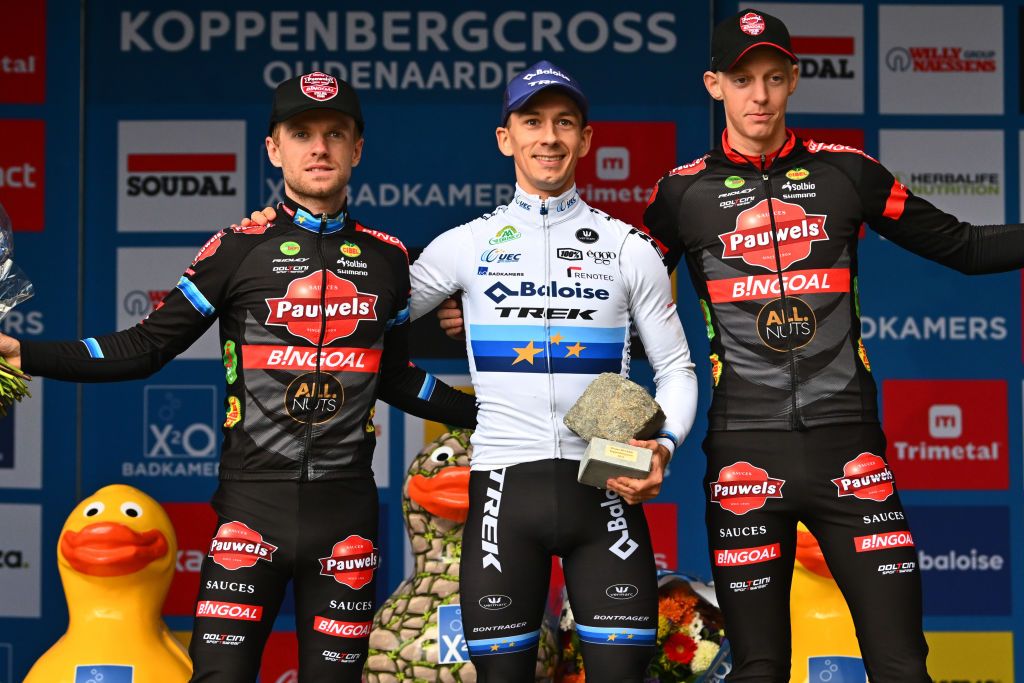 MAARKEDAL BELGIUM NOVEMBER 01 LR Eli Iserbyt of Belgium and Team Pauwels Sauzen Bingoal on second place race winner Lars Van Der Haar of The Netherlands and Team Baloise Trek Lions and Michael Vanthourenhout of Belgium and Team Pauwels Sauzen Bingoal on third place pose on the podium ceremony after the 33rd Trofee Oudenaarde Koppenbergcross 2022 Mens Elite on November 01 2022 in Maarkedal Belgium Photo by Luc ClaessenGetty Images