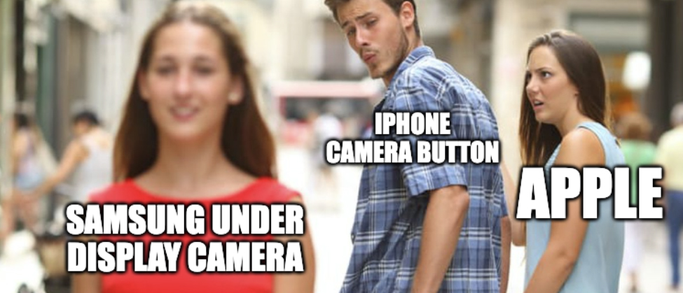 Distracted Boyfriend meme, depicting the girlfriend (Apple) looking at her boyfriend (iPhone Camera Button) being distracted by another woman (Samsung Under Display Camera)
