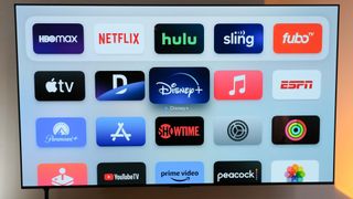 Cord-cutting live TV app icons such as YouTube TV, Sling TV, Fubo TV and Hulu on a TV alongside streaming service apps such as HBO Max, Netflix and Paramount Plus