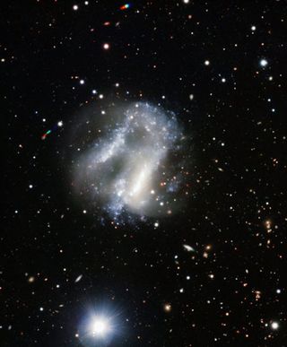 Telescope Captures Grouping of Oddball Galaxy and Supernova