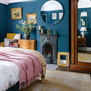 blue bedroom with fireplace