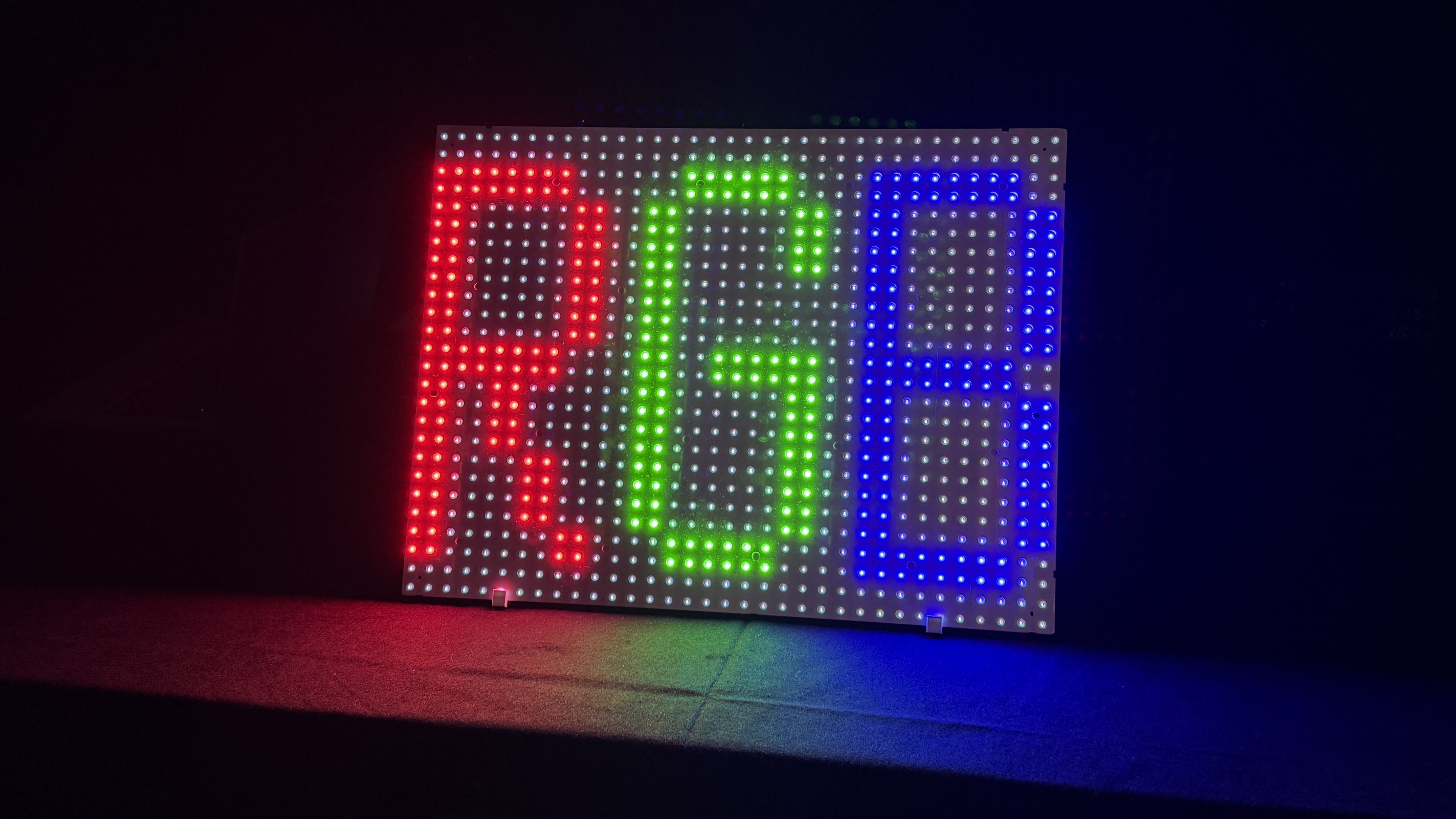 A section of an RGB backlit mini-LED panel, showing the letters R, G and B lit up in red, green and blue respectively