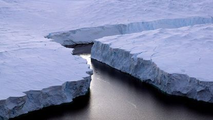  An enormous iceberg breaking off the Knox Coast in the Australian Antarctic Territory