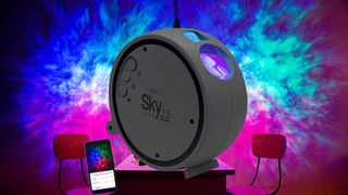 An image of a BlissLights Sky Lite 2.0 star projector against a backdrop of its colorful nebula pattern.