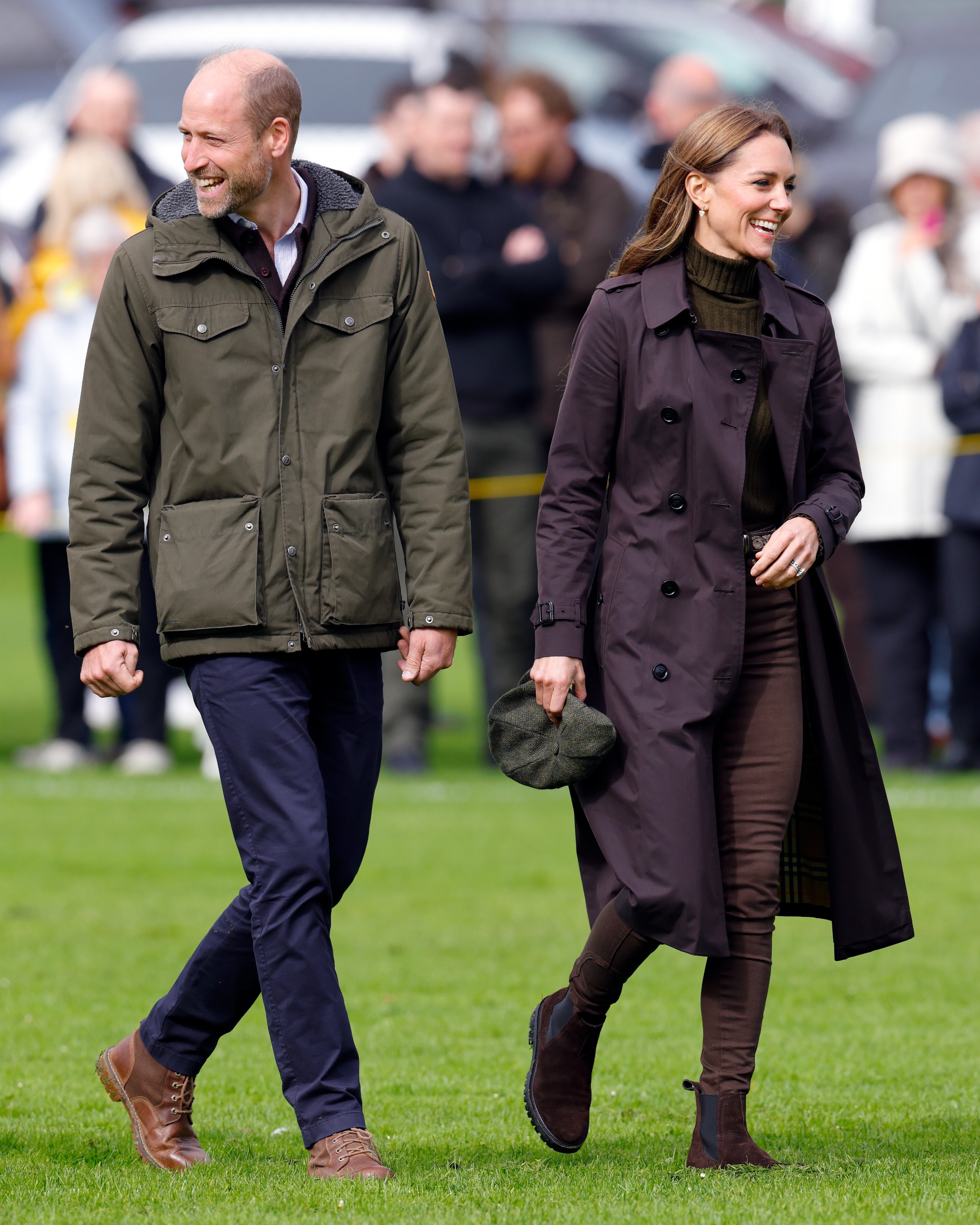 Prince William wears a flat cap with a green hooded coat to visit the Scottish island of Bute with Princess Kate