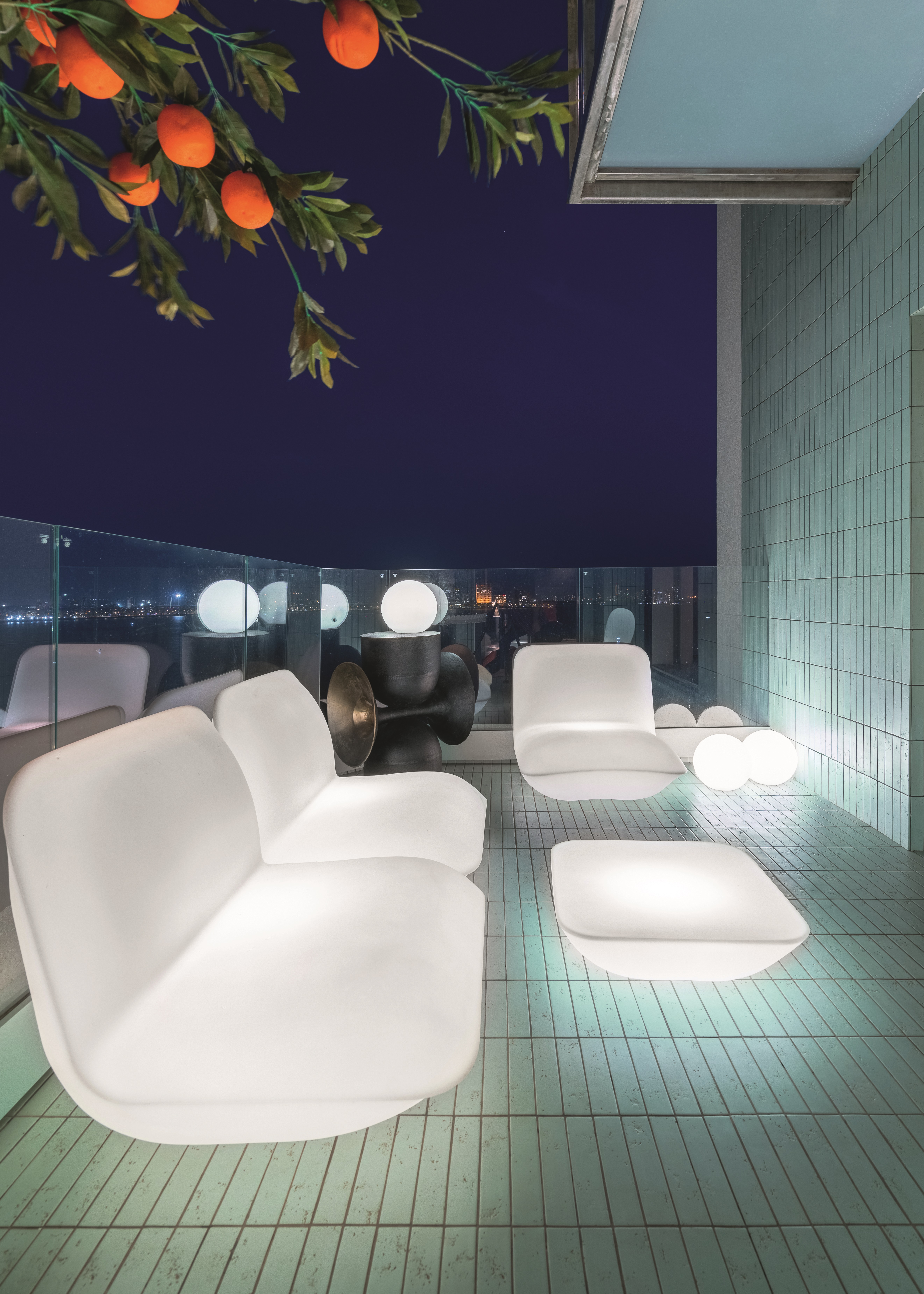 A balcony area with back-lit furniture