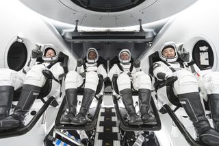 From left, Mission Specialist Shannon Walker, Pilot Victor Glover, Crew Dragon Commander Michael Hopkins – all NASA astronauts – and Japan Aerospace Exploration Agency (JAXA) astronaut and Mission Specialist Soichi Noguchi are seated in SpaceX’s Crew Dragon spacecraft during crew equipment interface training.