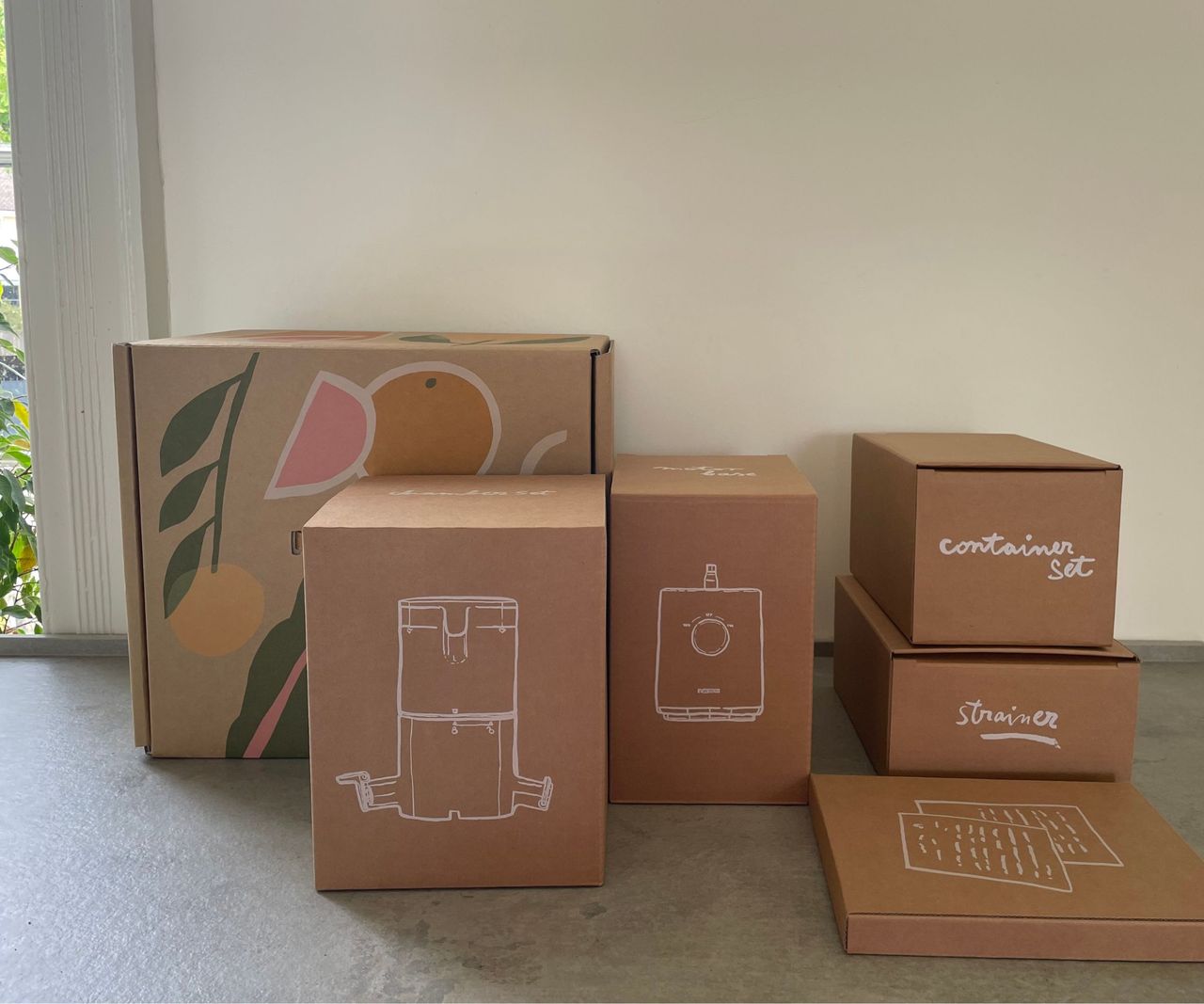 Nama J3 Juicer boxes on the countertop