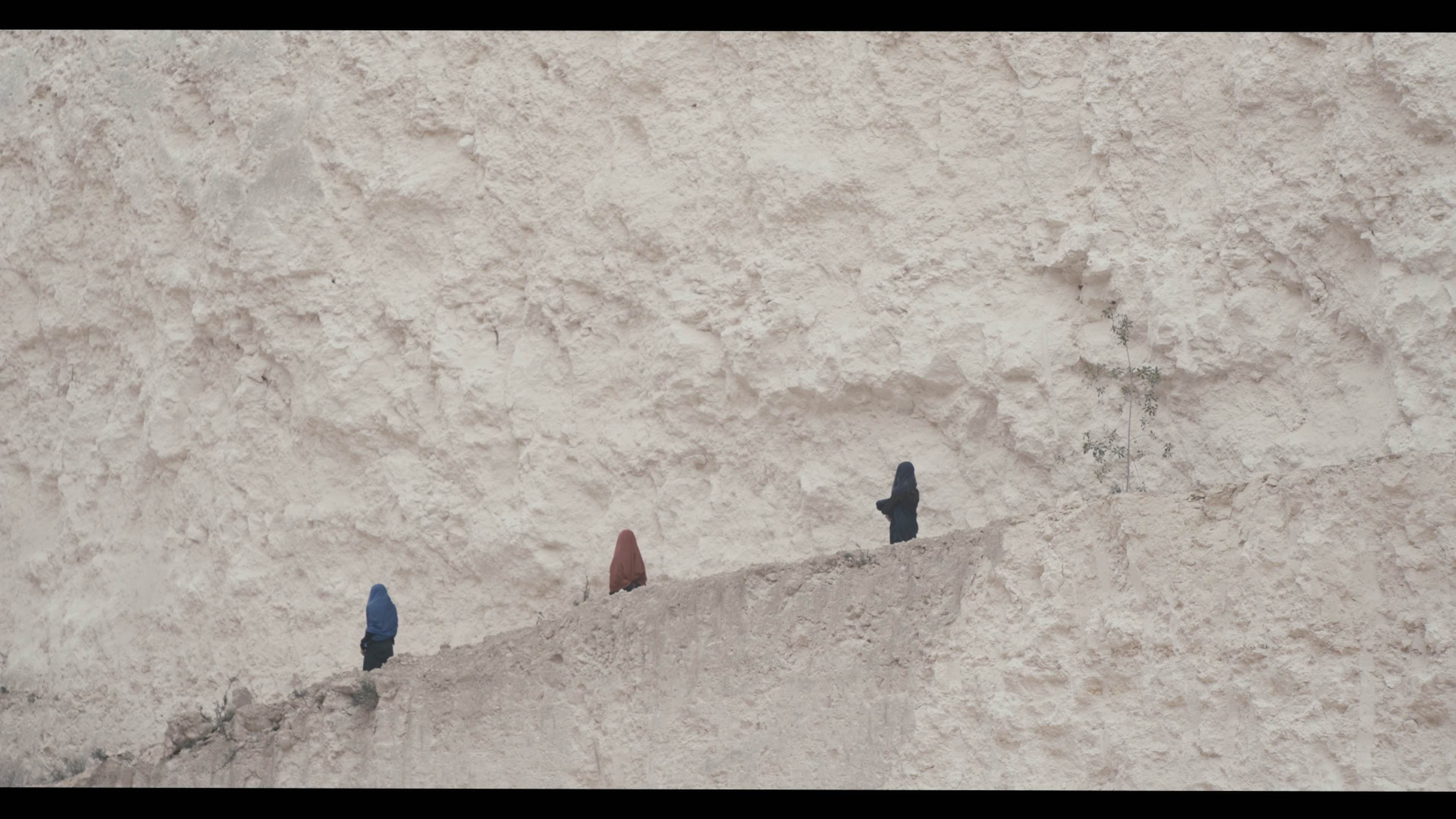 three women in duty stone quarry