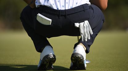 Why do some golfers putt without a glove?