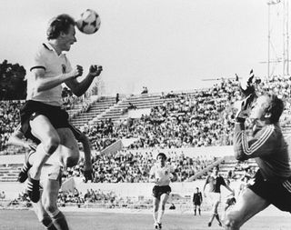 Karl-Heinz Rummenigge scores a header for West Germany against Czechoslovakia at the 1980 European Championship.