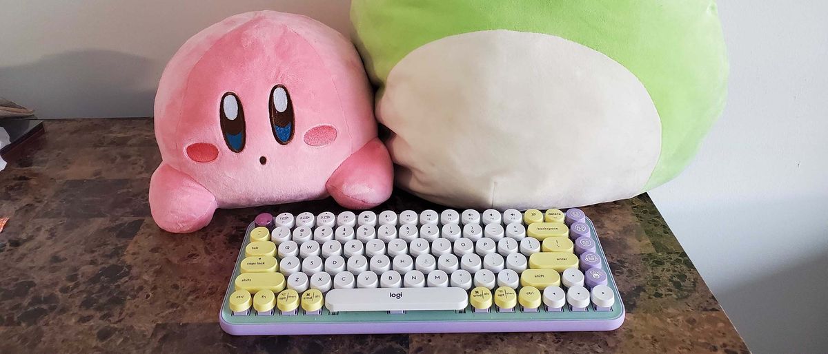 A Logitech Pop Keys keyboard on a counter