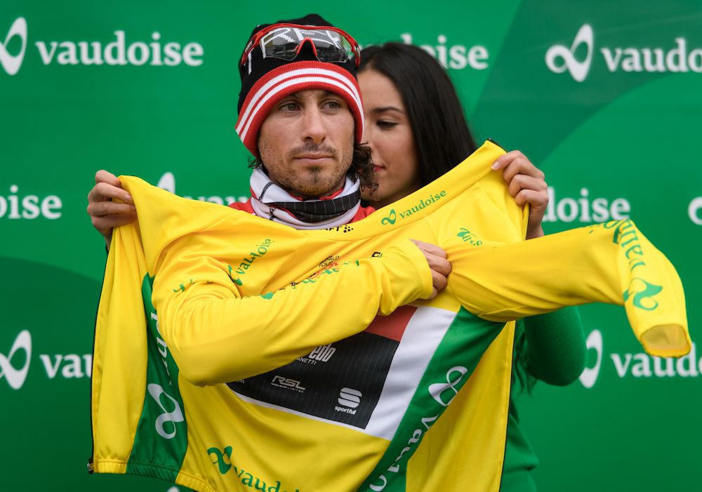 Fabio Felline (Trek-Segafredo) puts on the yellow jersey after stage 2 at Tour de Romandie