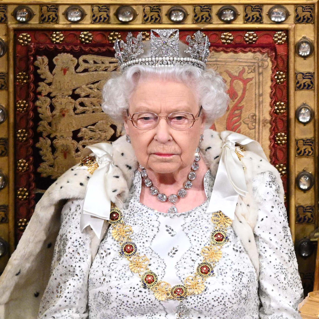 Queen Elizabeth wearing a crown at the state opening of Parliament