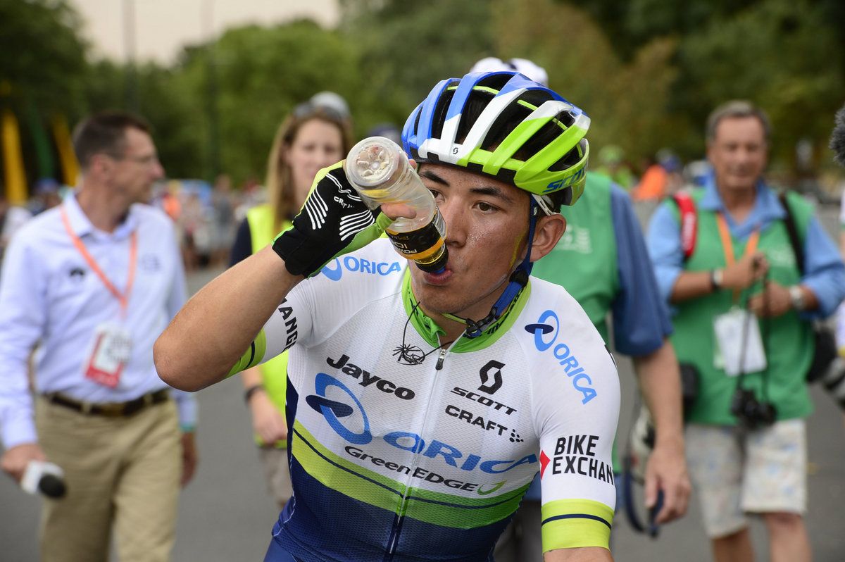 Caleb Ewan sucks down the energy drink after winning the stage