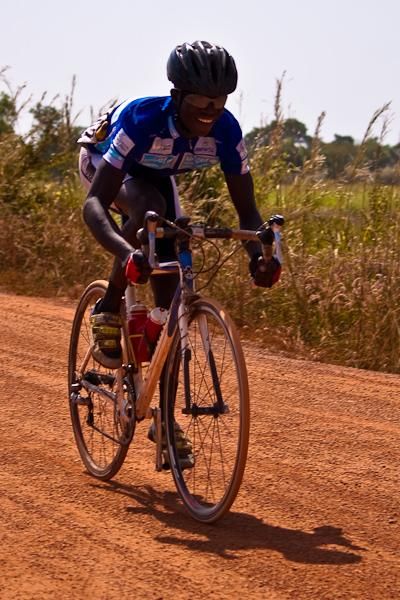 Burkina Faso&rsquo;s Etienne Tarbagdo pushes through the dirt track with over a minute&rsquo;s lead.