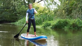 Woman on stand-up paddleboard