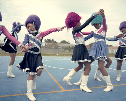 girls in majorette costumes dancing