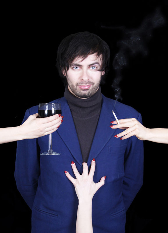 Alexis Dubas&#039;s comedy Frenchman character Marcel Lucont with wine and a cigarette being placed before him by hands from outside the frame