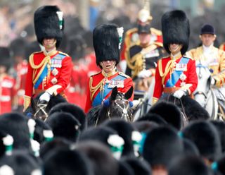 King Charles [center] rides a horse at Trooping the Colour on June 17, 2023