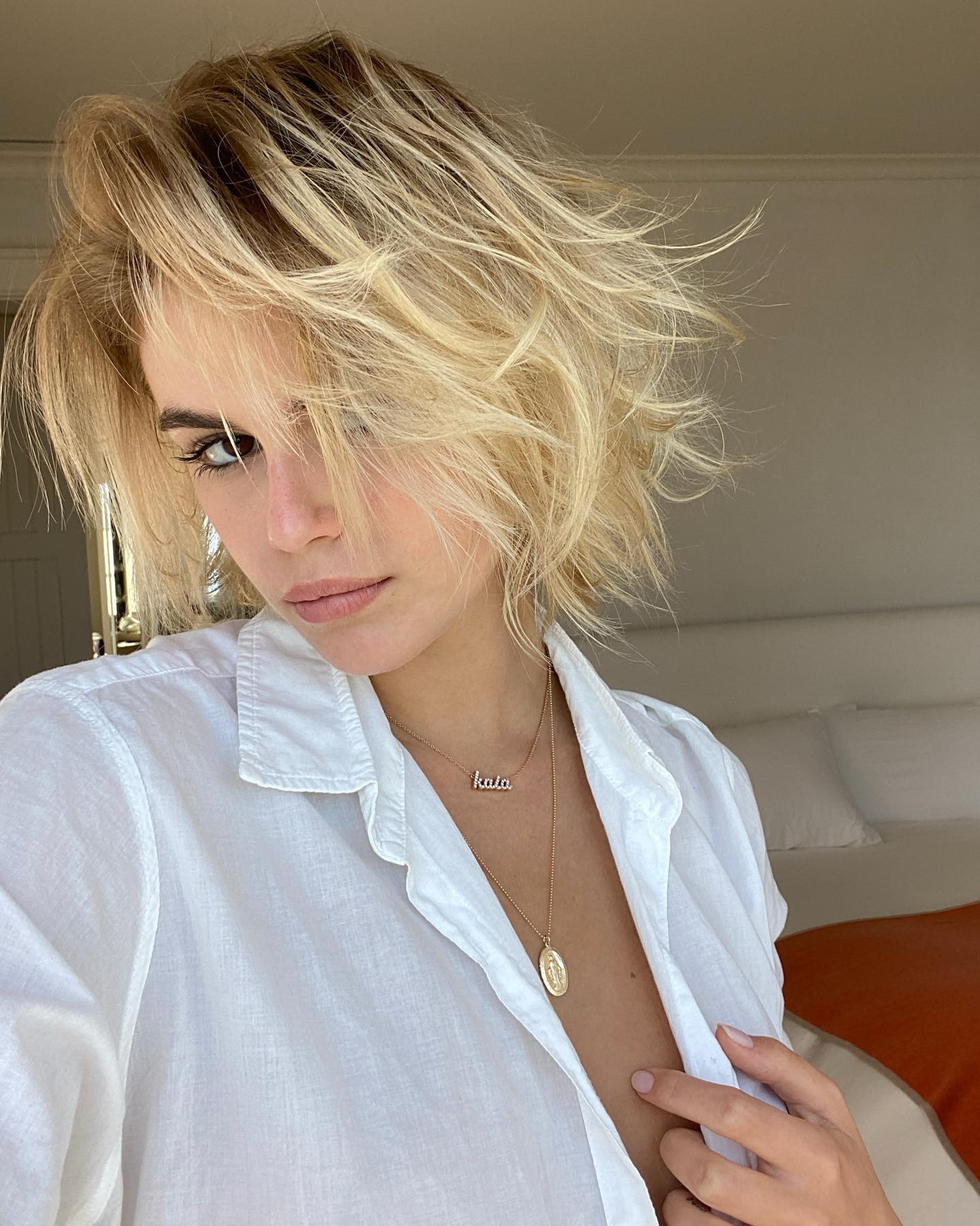 Kaia Gerber wearing a short, bleached blonde bob