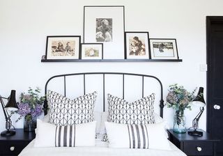 bedroom with black and white cushions and table lamp