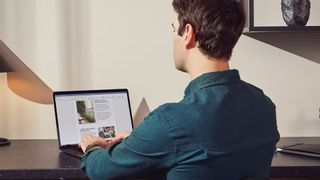 Man using Microsoft office on a MacBook