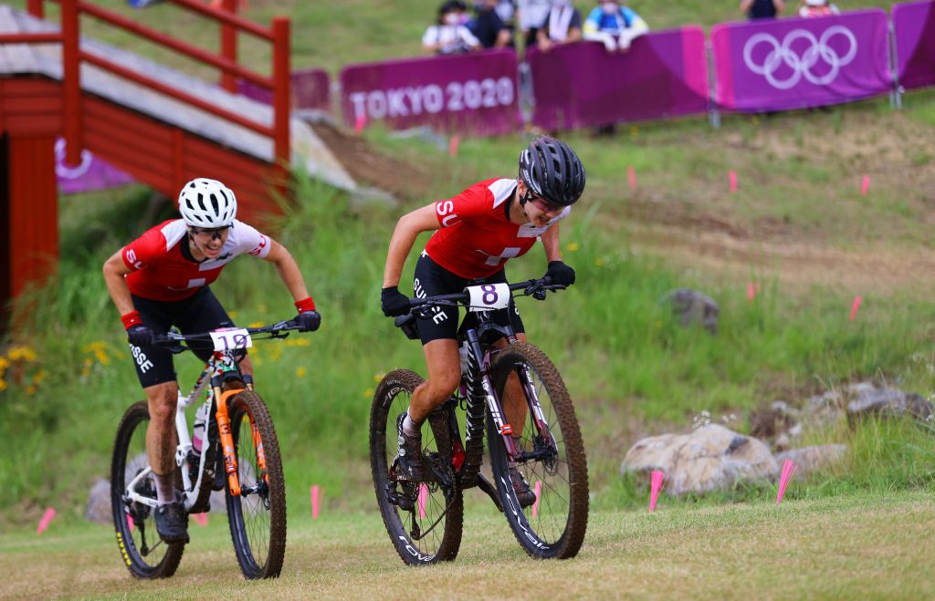 IZU JAPAN JULY 27 LR Linda Indergand and Sina Frei of Team Switzerland ride during the Womens Crosscountry race on day four of the Tokyo 2020 Olympic Games at Izu Mountain Bike Course on July 27 2021 in Izu Shizuoka Japan Photo by Tim de WaeleGetty Images