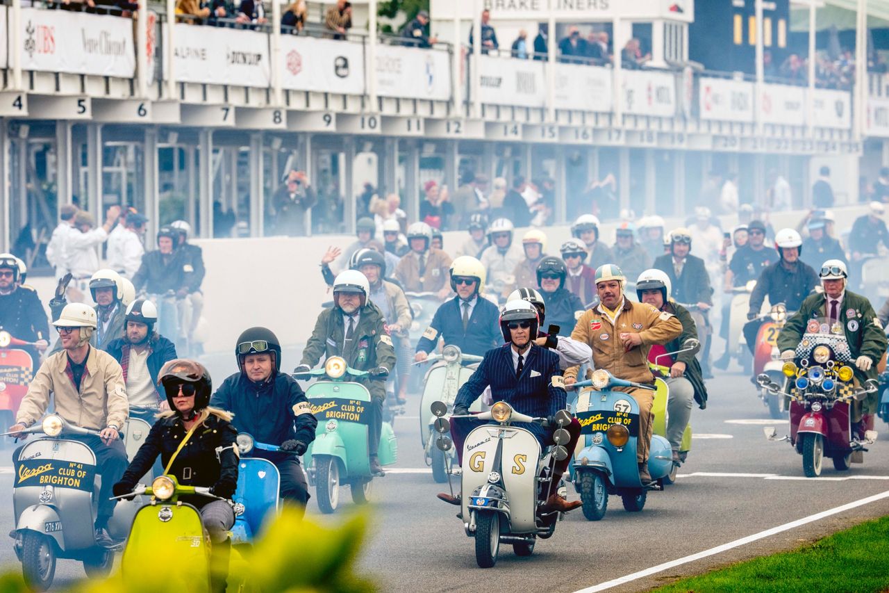 Images from the Revival. Fast cars, people in vintage dress, everyone having a nice time.