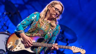 Susan Tedeschi plays guitar as she performs with the Tedeschi Trucks Band on opening night of the 30th Anniversary season of Central Park SummerStage, New York, New York, May 18, 2015.