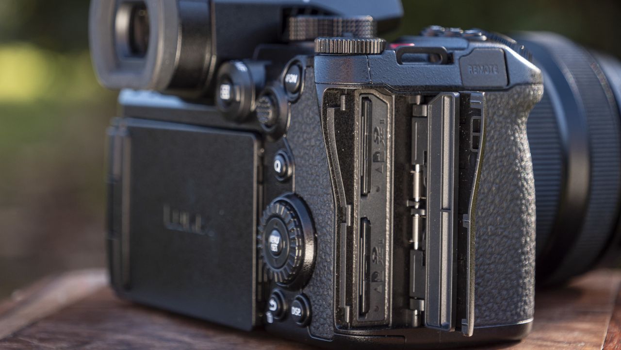 Panasonic Lumix S5 II camera on a table with memory card door open