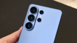 Author with Samsung Galaxy S26 Ultra in hand, focusing on the camera module