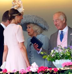 King Charles smiling next to Queen Camilla, talking to Harriet Sperling and Peter Phillips at Royal Ascot