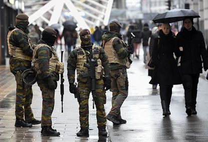 Soldiers patrol a street in Brussels