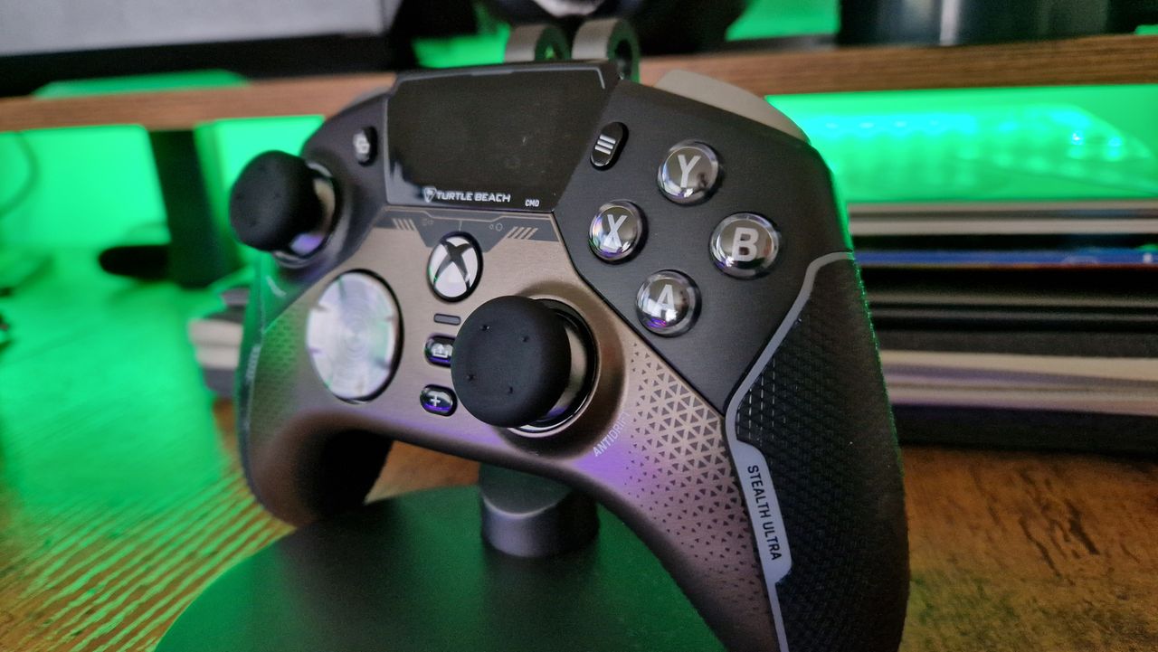 Turtle Beach Stealth Ultra Wireless controller on a stand in front of green lighting