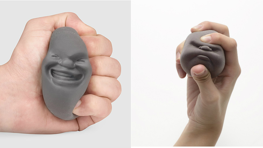 Face-shaped stress balls being squeezed