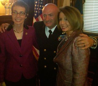 Nancy Pelosi poses wiith Rep. Giffords at Captain Mark Kelly’s military retirement ceremony.
