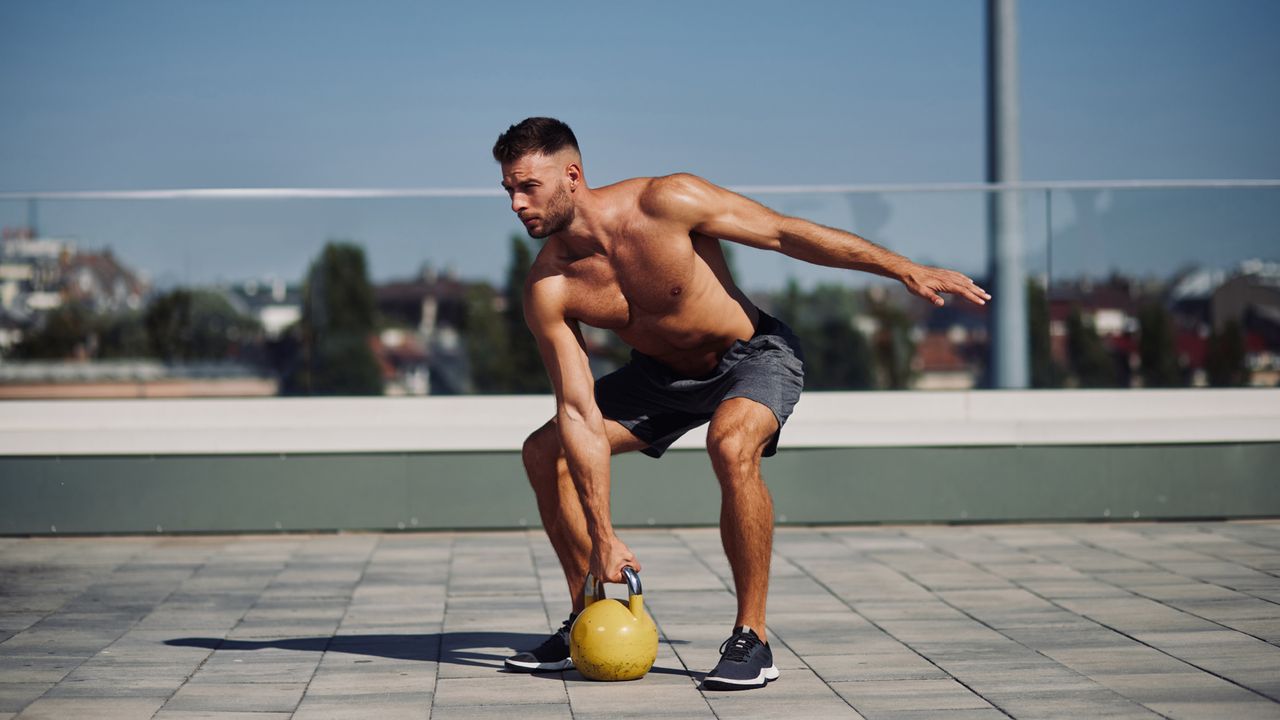 Man exercising with a kettlebell