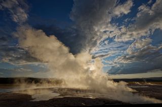 Photograph of sunrise over one of Yellowstone National Park’s geysers, taken by Charles Glatzer