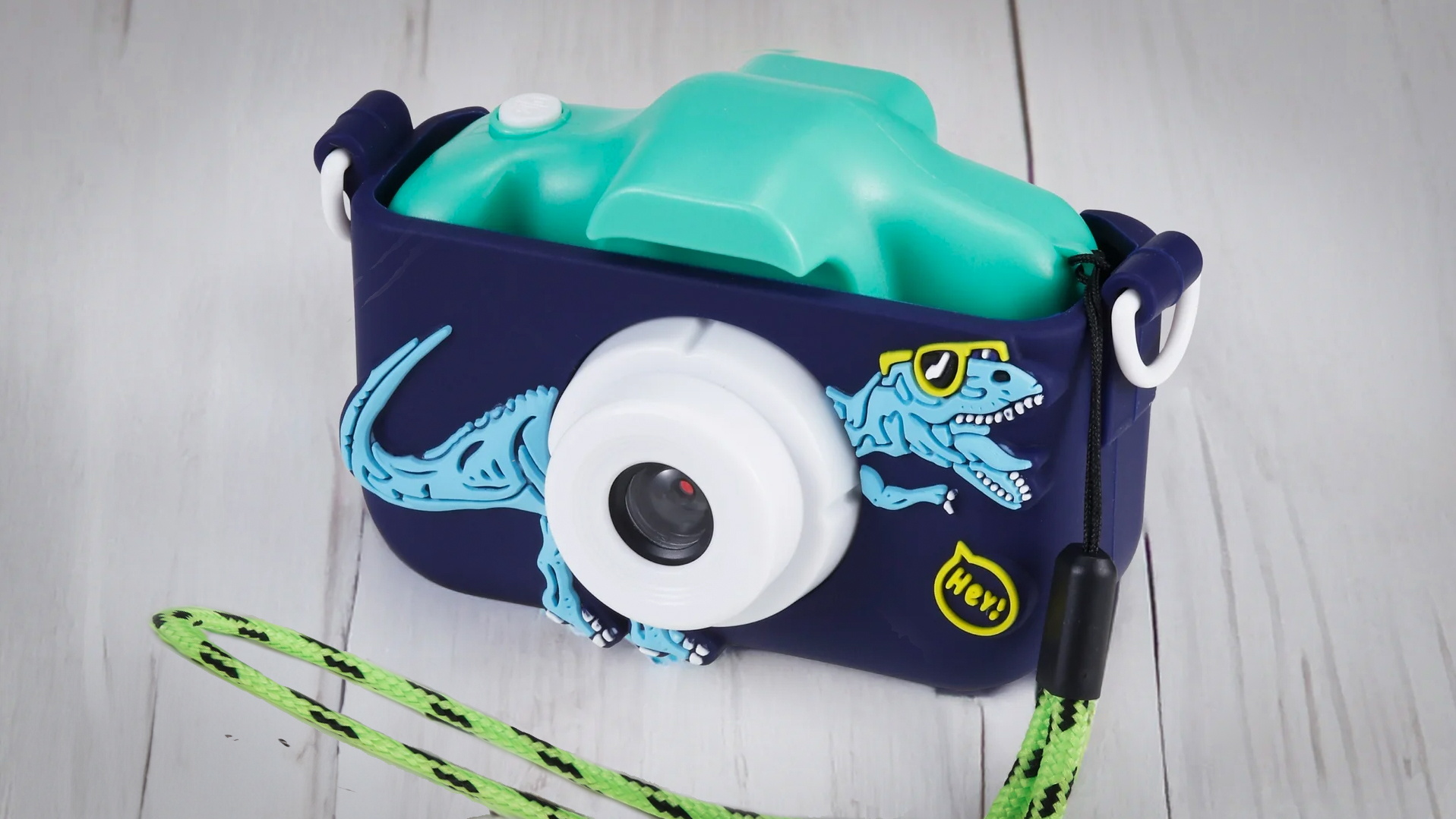 Vivitar Kidzcam Dinosaur on a wooden grey surface