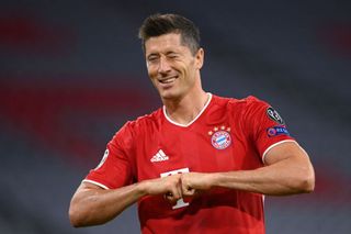 Robert Lewandowski of Bayern Munich celebrates after he scores his sides first goal from the penalty spot during the UEFA Champions League round of 16 second leg match between FC Bayern Muenchen and Chelsea FC at Allianz Arena on August 08, 2020 in Munich, Germany.