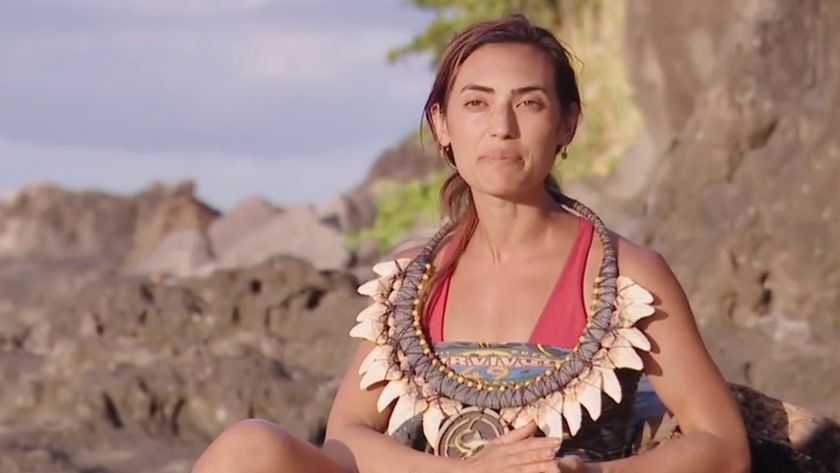 Savannah talks to the camera during a Survivor confessional with the immunity necklace around her neck.