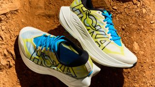 A press image provided by Hoka shows the Hoka Rocket Trail lying in the dirt