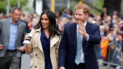 melbourne, australia october 18 prince harry, duke of sussex and meghan, duchess of sussex wave to the crowd as they arrive at the royal botanic gardens on october 18, 2018 in melbourne, australia the duke and duchess of sussex are on their official 16 day autumn tour visiting cities in australia, fiji, tonga and new zealand photo by phil noble poolgetty images
