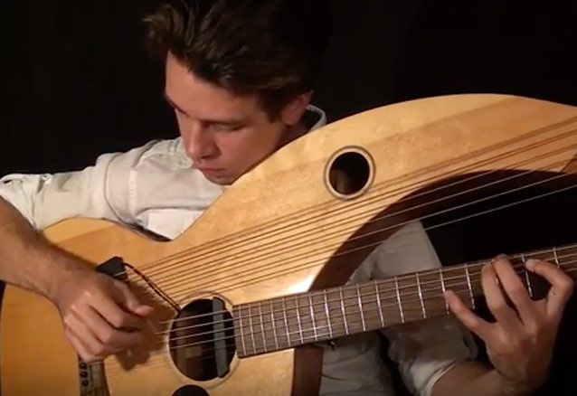 guitarist-plays-stranger-things-theme-song-on-a-harp-guitar-guitar