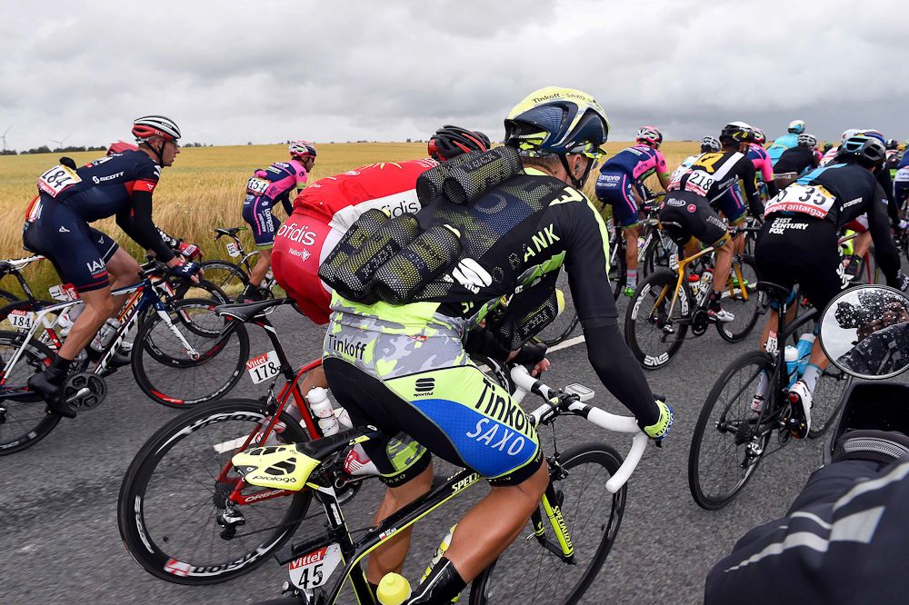 Tinkoff's water bottle vest gets a workout.