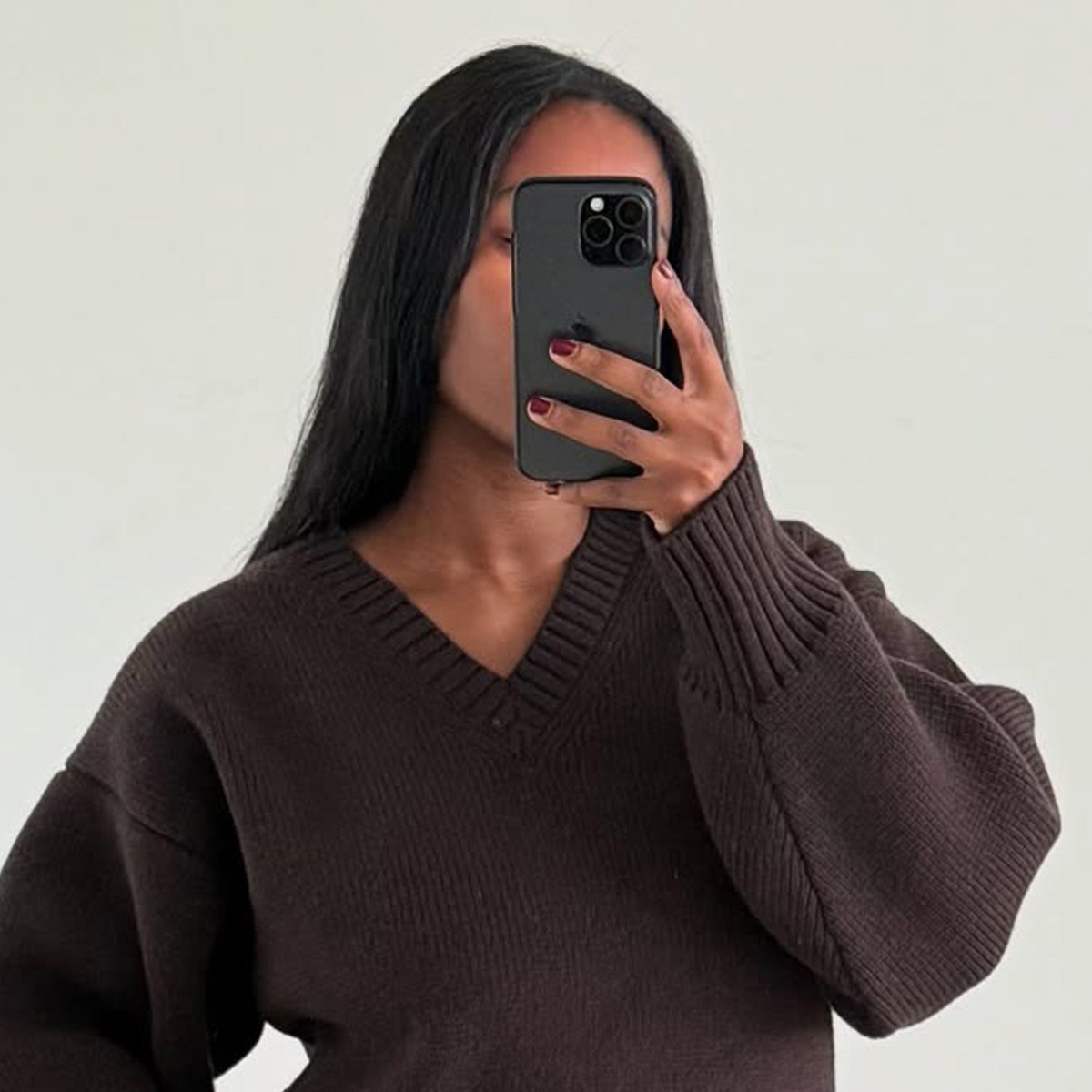 A mirror selfie of @nlmarilyn wearing a brown sweater with chestnut-colored pants.